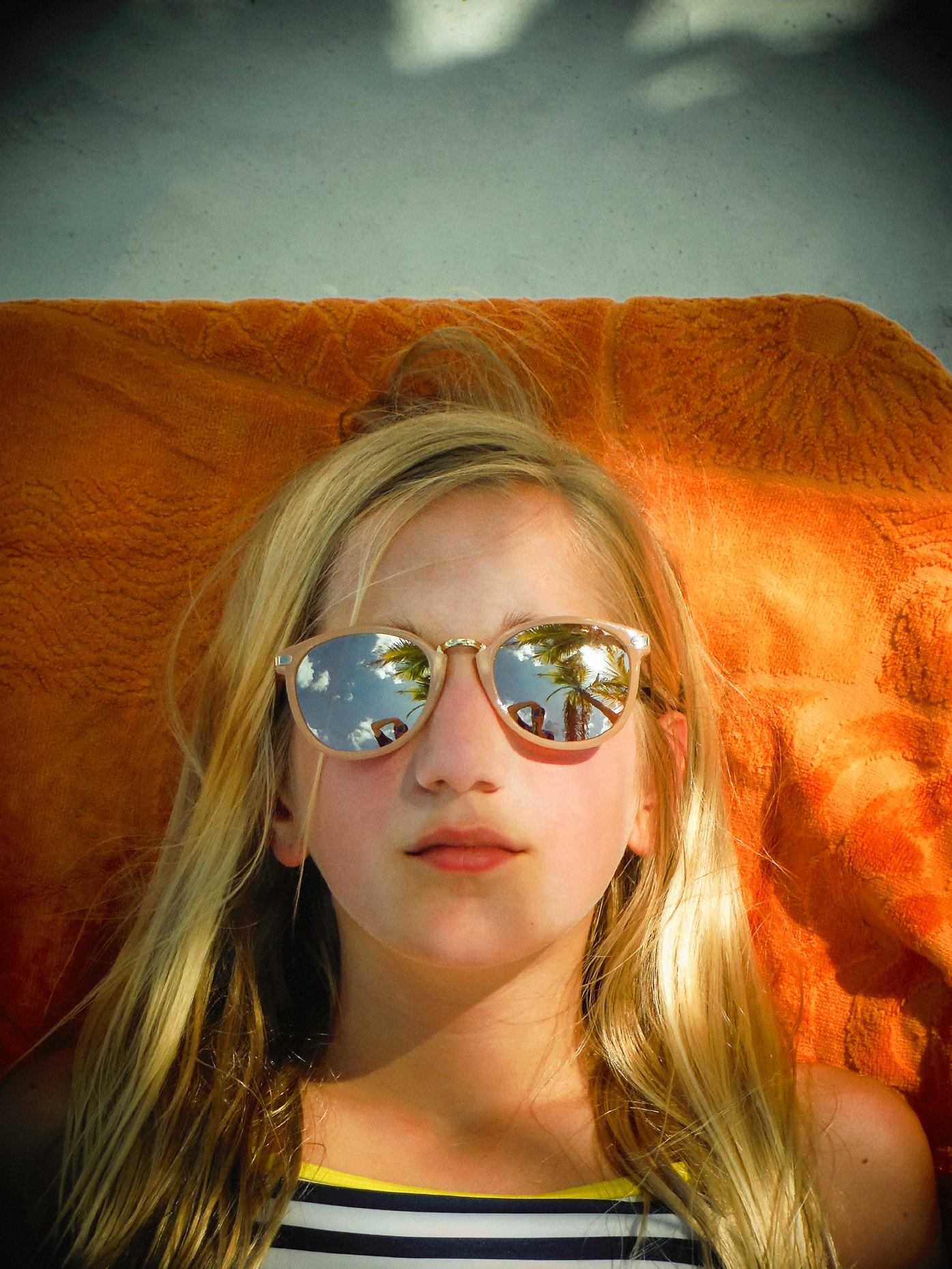 Portrait of a young Girl on an Orange Towel 